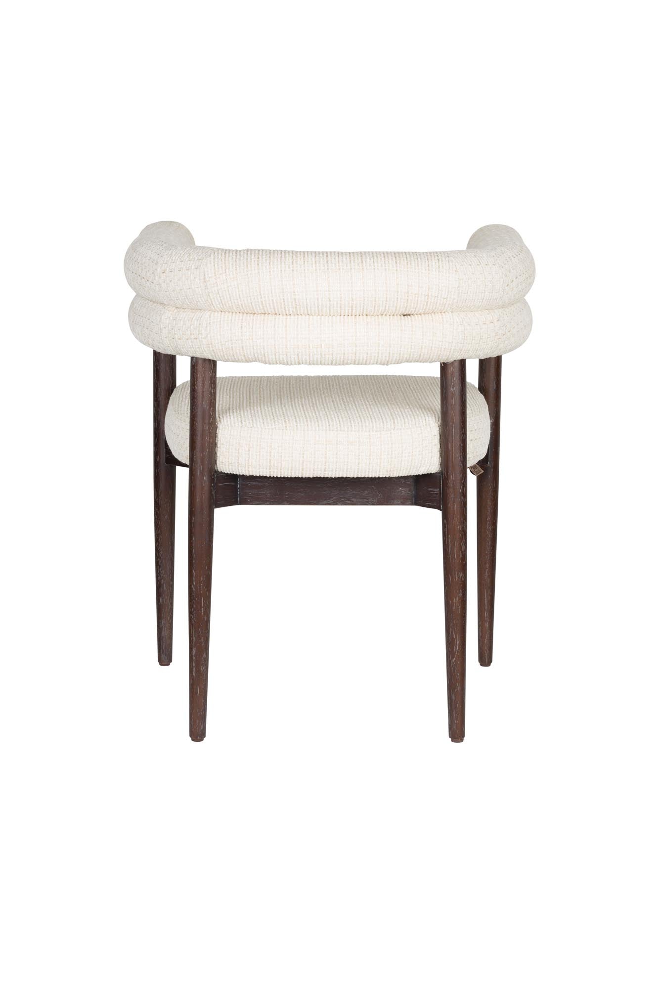 Der Sela Esszimmerstuhl von Dutchbone: stilvolles Design, komfortabel gepolstert, perfekt für moderne Wohn- und Essbereiche.