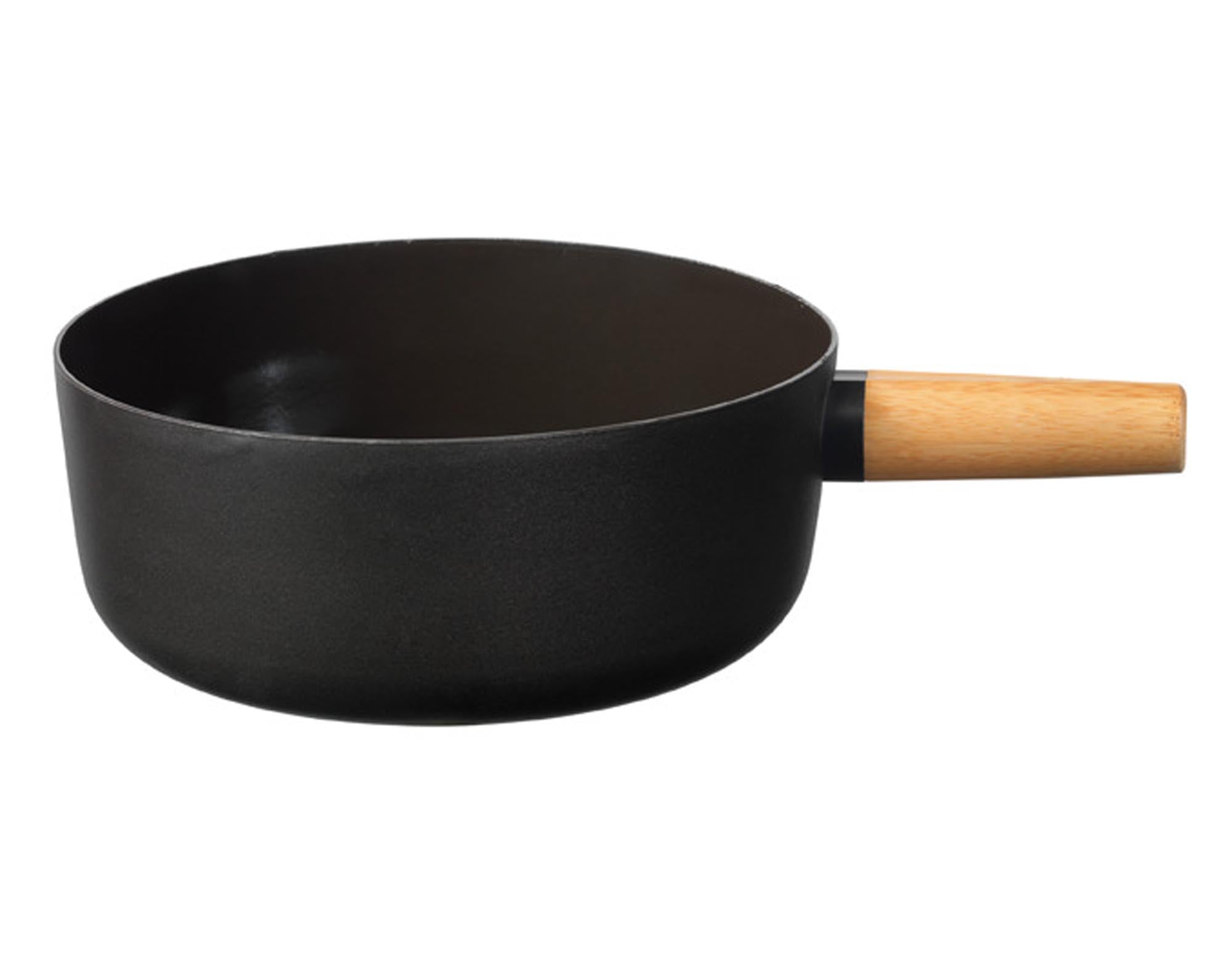 Hochwertiges Fonduecaquelon Emotion von STÖCKLI, 23 cm, mit ergonomischem Holzgriff. Ideal für gesellige Fondue-Runden und vielseitige Rezepte.