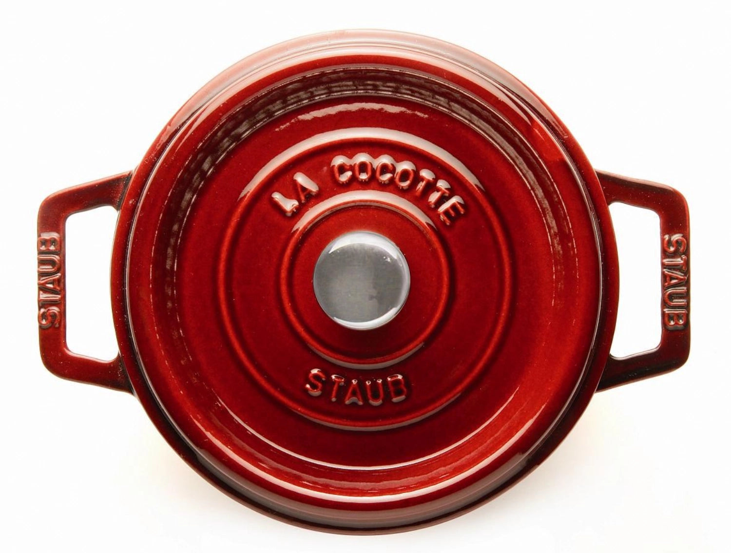 Die Staub Cocotte 24 cm in Grenadine-Rot vereint stilvolles Design und Funktionalität. Ideal für köstliche Gerichte im Gusseisen.