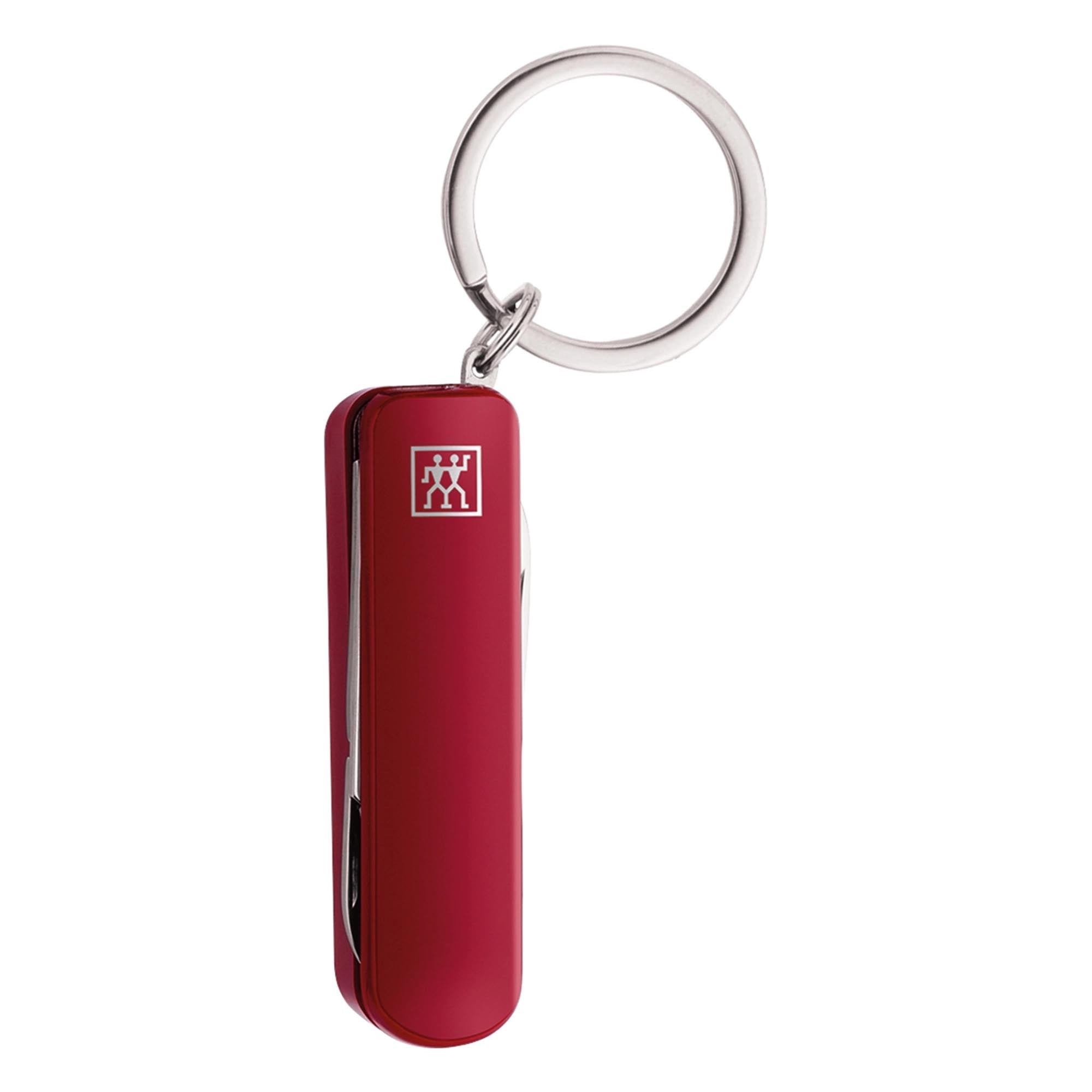 Praktisches Multi-Tool von Zwilling Beauty in leuchtendem Rot, 57 mm groß, perfekt für schnelle Lösungen und immer griffbereit am Schlüsselanhänger.