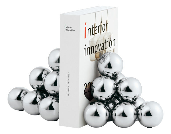 Entdecken Sie die elegante Buchstütze BUBBLES von PHILIPPI – ein stilvolles Accessoire aus Edelstahl, das Bücher sicher hält und Ihr Regal aufwertet.