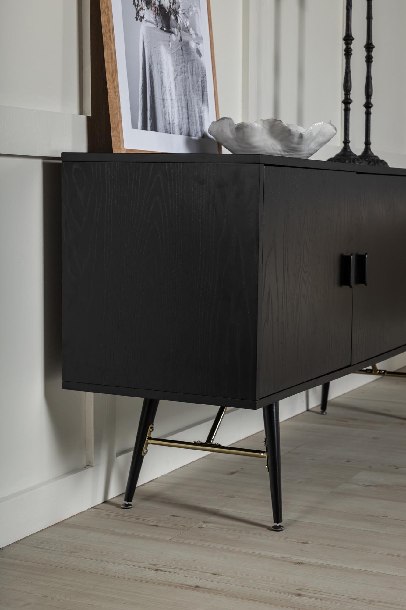 Elegante Gold Kommode von Venture Home: Schwarzes Furnier, Messingdetails, stilvoll und funktional. Perfekt für jeden Raum.