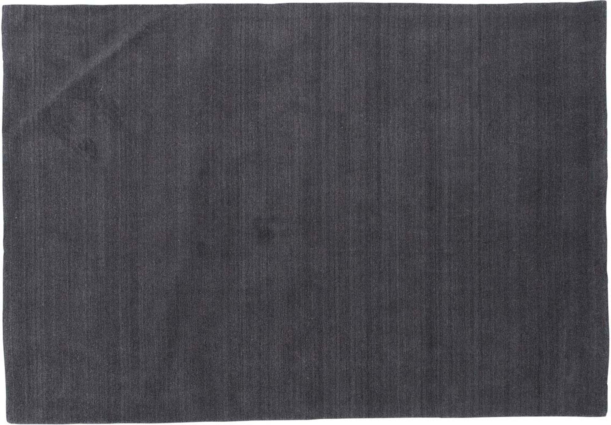 Entdecken Sie den Ulla Teppich von Venture Home: eleganter Wollteppich in dunkelgrau, weich, strapazierfähig und ideal für jedes Zuhause.