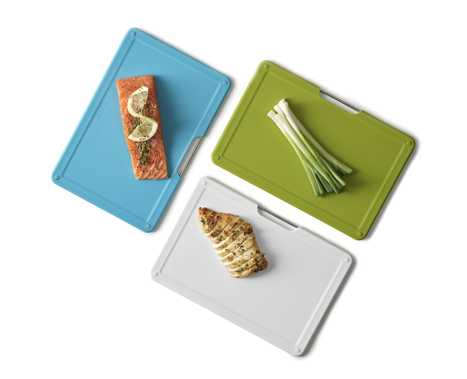 Elegantes 3-teiliges Schneidebrett-Set von Joseph Joseph, perfekt für effizientes Kochen und platzsparende Aufbewahrung in der Küche.