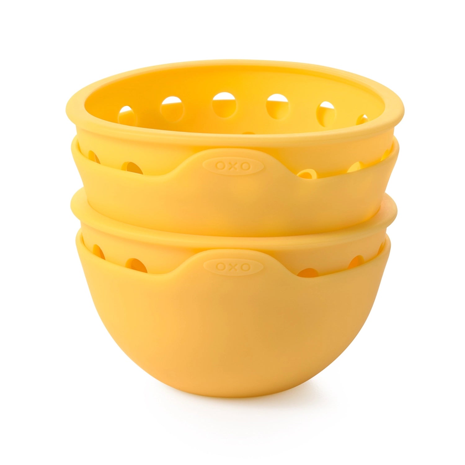 Zwei gelbe Silikon-Eier-Pochierer von OXO, ideal für die einfache und mühelose Zubereitung von köstlichen, perfekt pochierten Eiern.