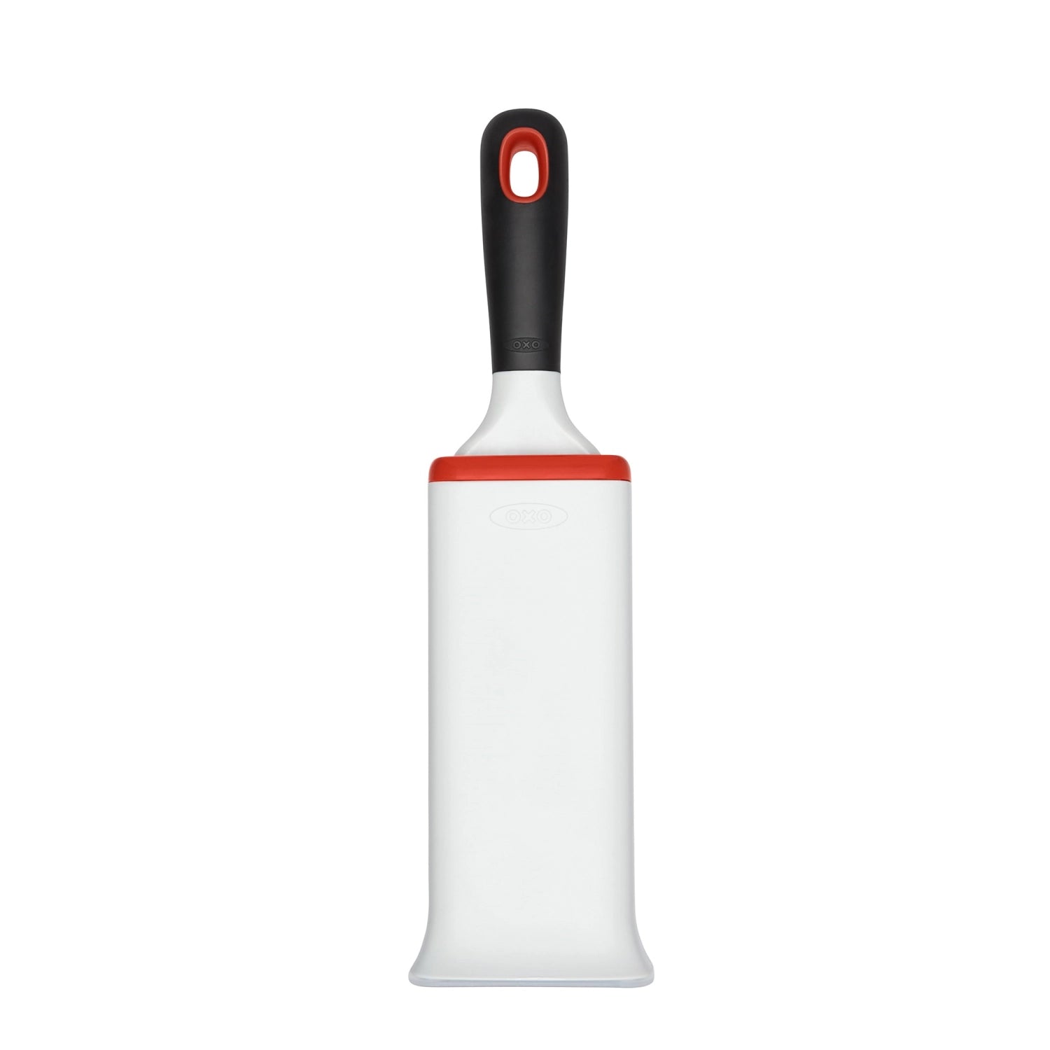Praktische Flusenentferner-Bürste in ansprechendem Weiß-Orange von OXO, perfekt für die mühelose Entfernung von Fusseln und Haaren.