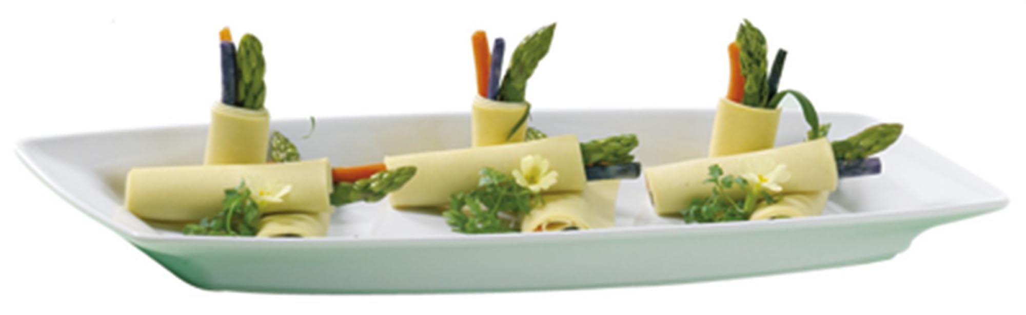 Stilvolle weisse Servierplatte von Revol, ideal für Buffets.