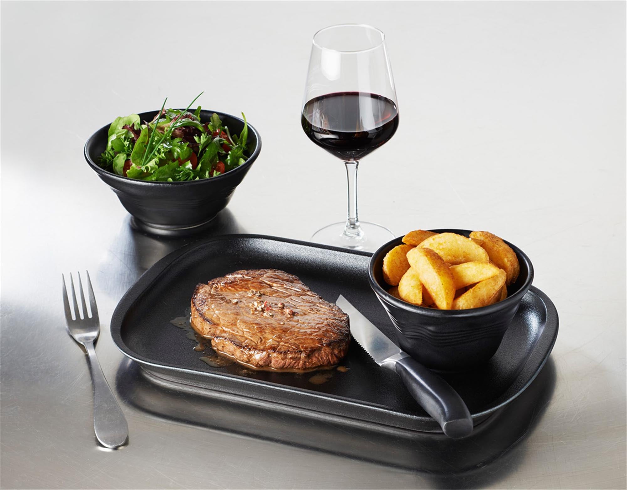 Schwarze Fleischplatte von Revol, 32x21 cm, ideal für stilvolle Präsentation von Fleisch und Käse, elegant und funktional.