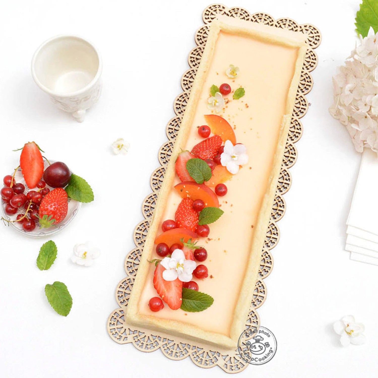 Perforierte Edelstahlbackform von Scrap Cooking, ausziehbar von 22-24 cm, ideal für gleichmäßiges Backen und vielseitige Einsatzmöglichkeiten.