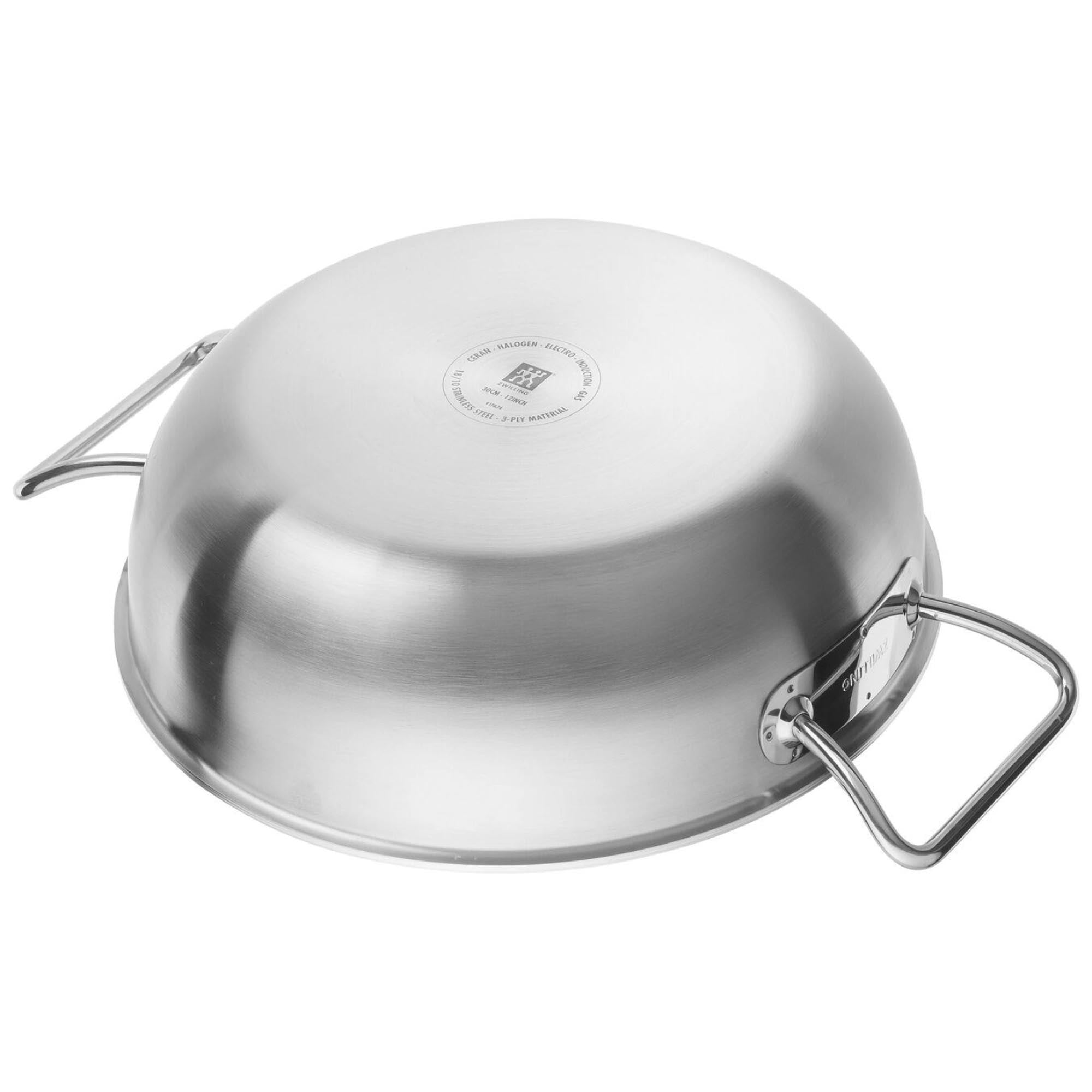 Entdecken Sie den ZWILLING Pro Wok, 30 cm: Robuster Edelstahl, perfekt für kreative Kochabenteuer und gleichmäßige Wärmeverteilung für köstliche asiatische Speisen.