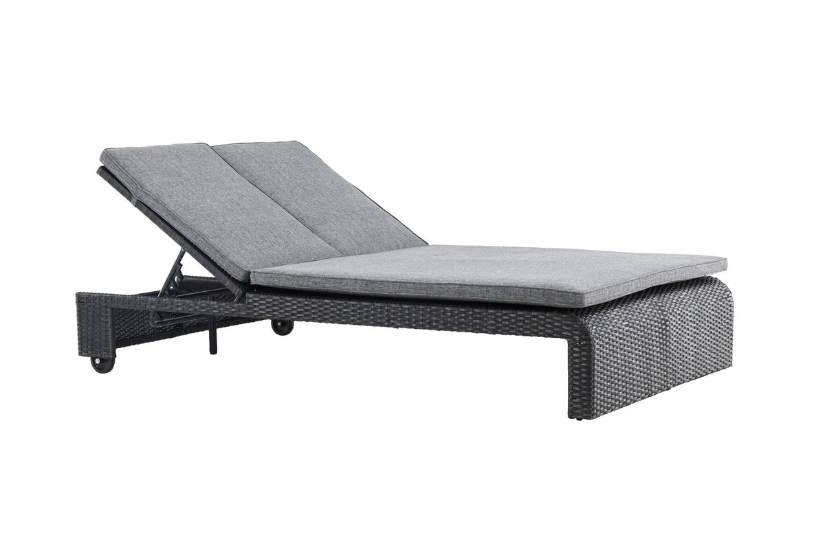 Sonnenliege London von Venture Home in Schwarz mit grauem Kissen und Korbgeflecht