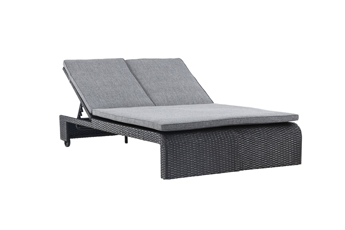 Sonnenliege London von Venture Home in Schwarz mit grauem Kissen und Korbgeflecht