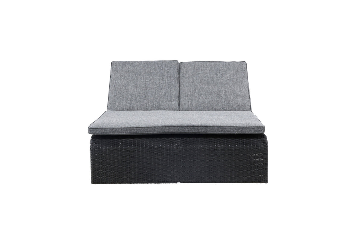 Sonnenliege London von Venture Home in Schwarz mit grauem Kissen und Korbgeflecht