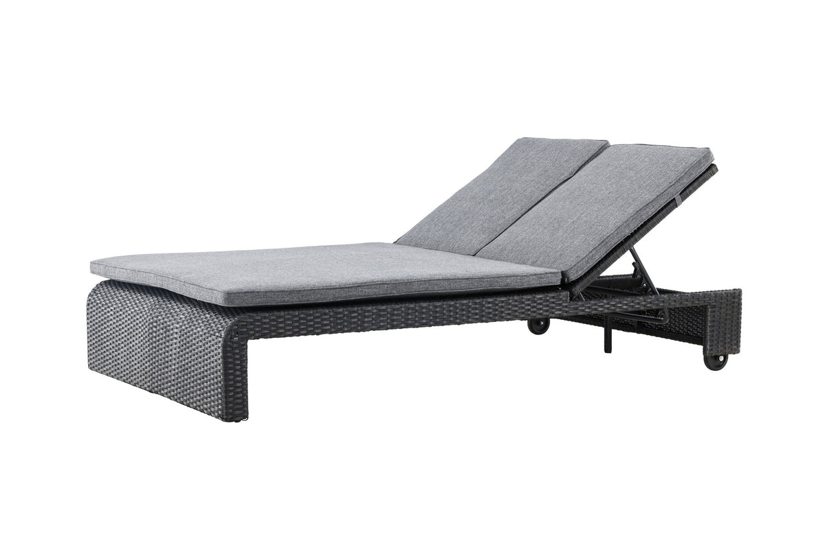 Sonnenliege London von Venture Home in Schwarz mit grauem Kissen und Korbgeflecht