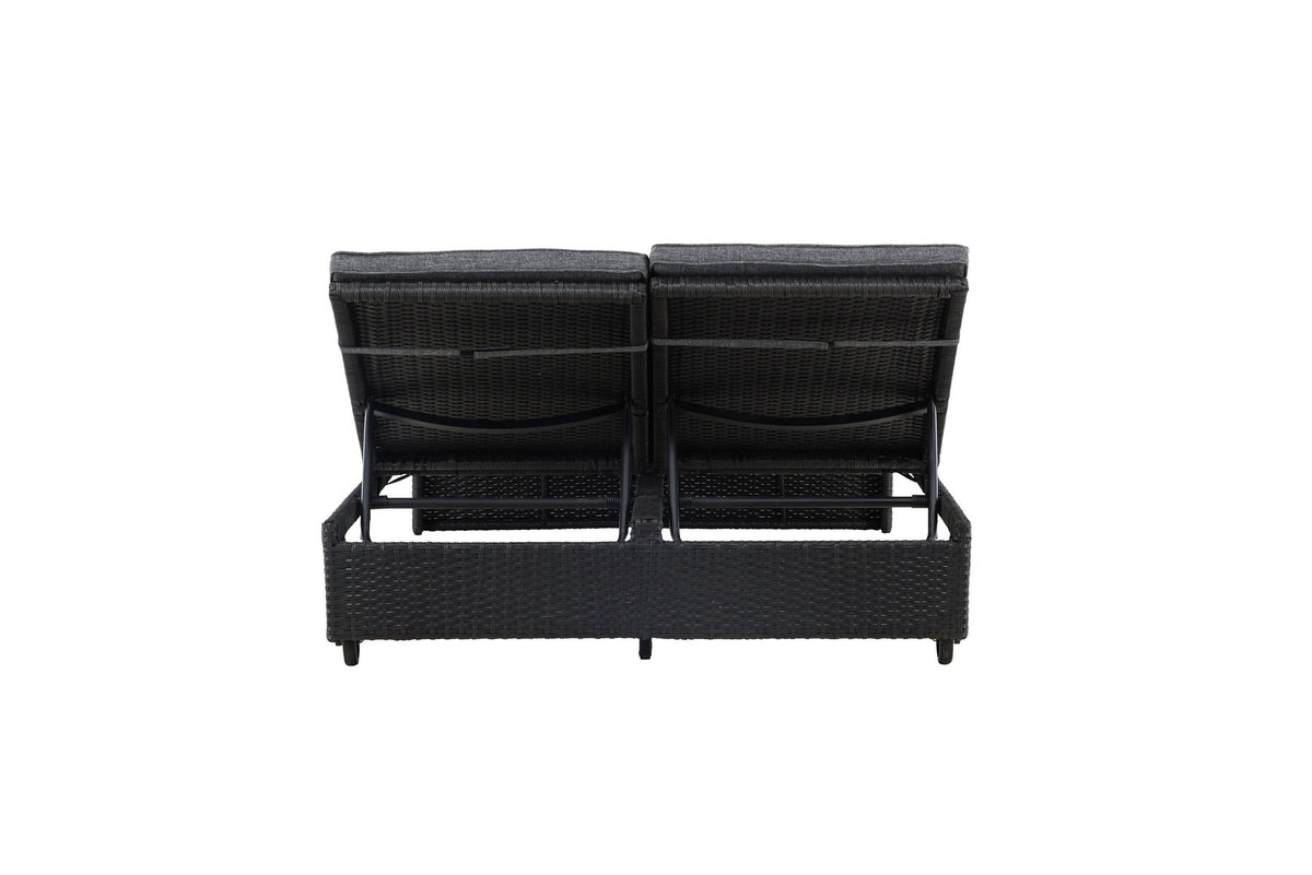 Sonnenliege London von Venture Home in Schwarz mit grauem Kissen und Korbgeflecht