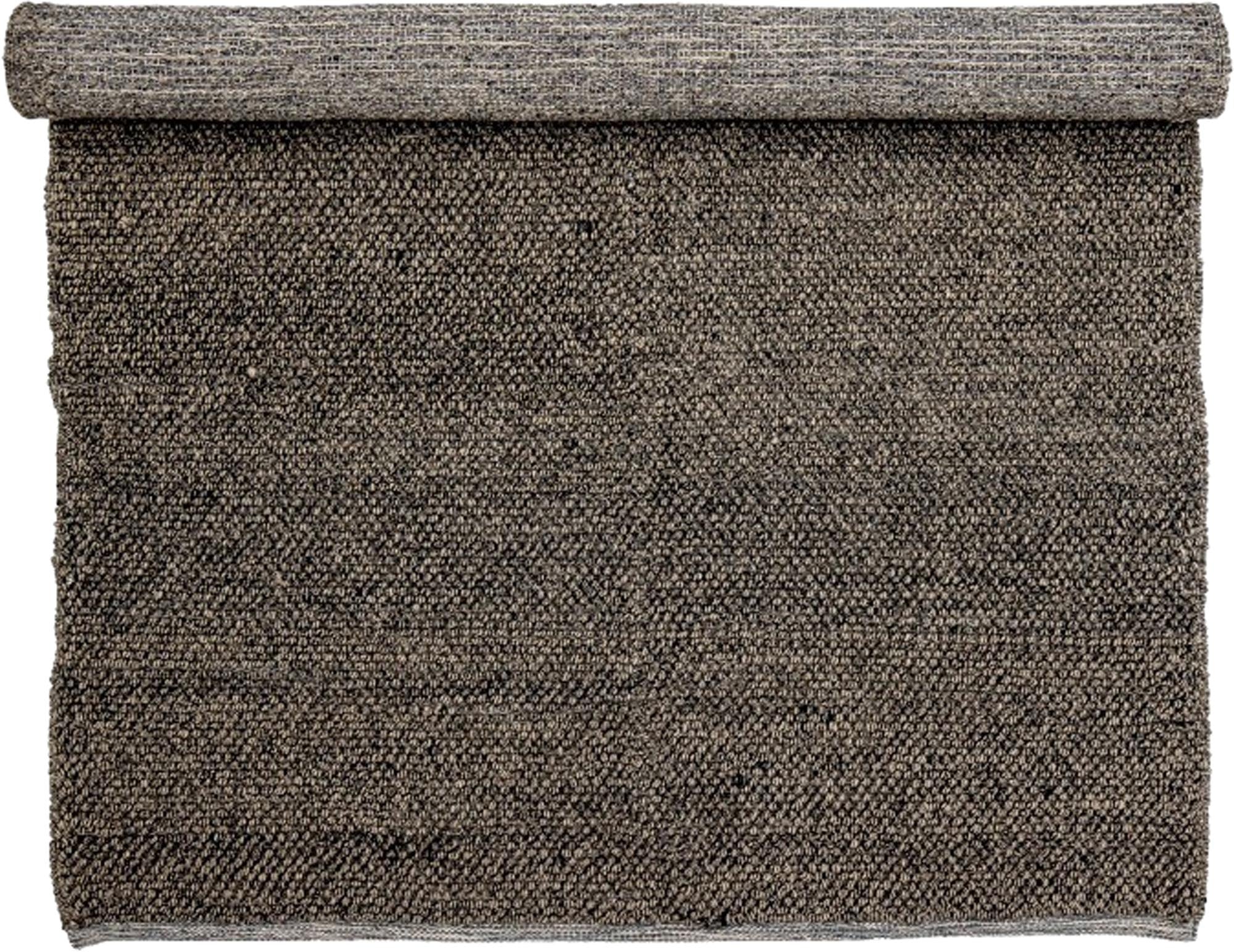 Entdecken Sie den stilvollen grauen Wollteppich von Bloomingville – ein zeitloses Wohnaccessoire, das jedem Raum Wärme und Eleganz verleiht.