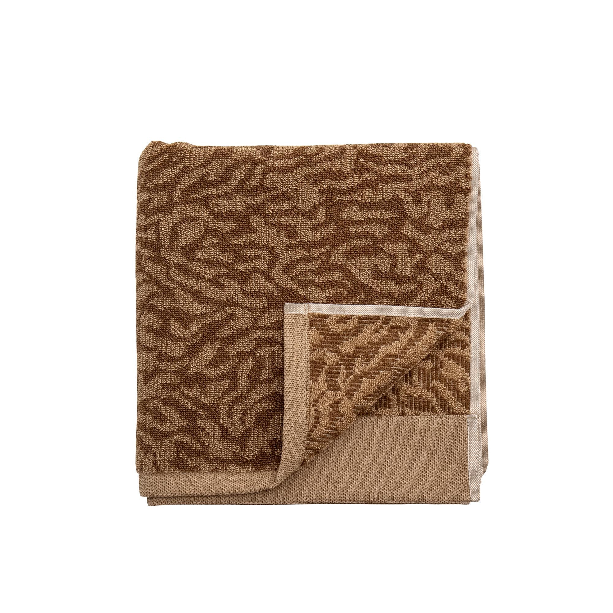 Entdecken Sie das stilvolle Kaysa Handtuch von Bloomingville in Braun. Hergestellt aus 100% Baumwolle, bietet es Komfort und Saugfähigkeit.