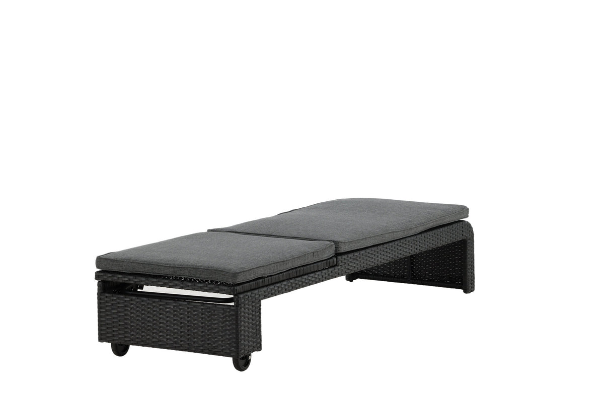 Sonnenliege London von Venture Home in Schwarz mit grauem Kissen und Korbgeflecht
