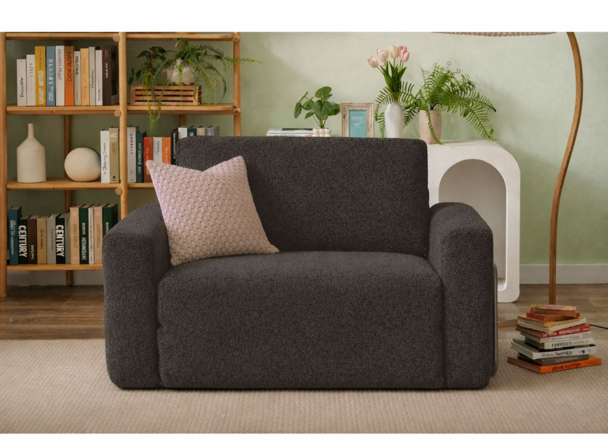 Anthrazitfarbenes 1-Sitzer Schlafsofa Wello aus 100% Bouclé-Stoff mit Sitzhöhe 35 cm und abnehmbarem, waschbarem Bezug von Hanah Home.