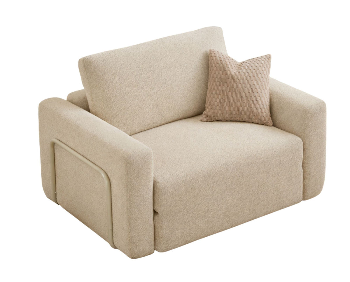 Cremefarbenes 1-Sitzer Schlafsofa Wello aus Bouclé-Stoff mit kompakter Sitzfläche und ausklappbarer Liegefläche im Wohnraum.