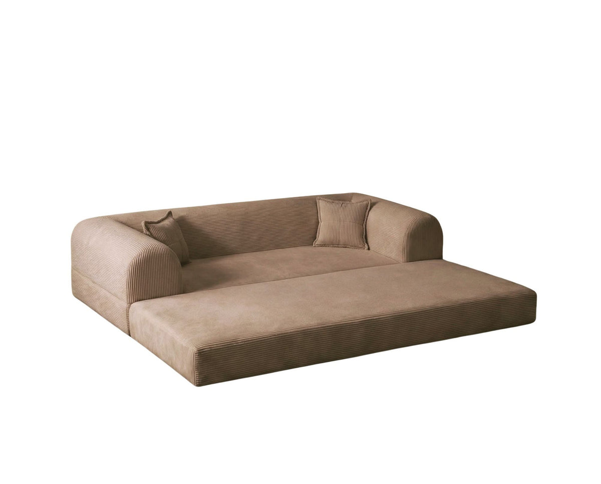Beiges 3-Sitzer Schlafsofa aus geripptem Plüschstoff mit zwei Kissen, rutschfester Sohle und klar gerader Formgebung.
