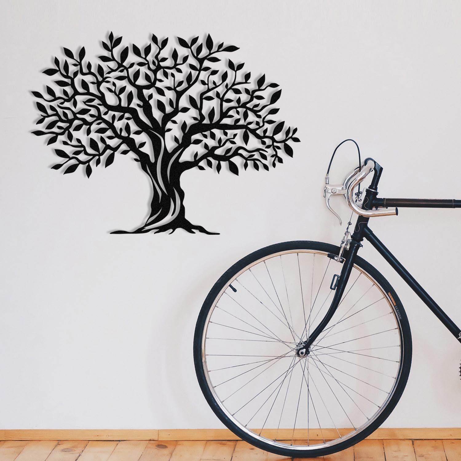 Verleihen Sie Ihrem Zuhause mit der Yaprak Dokumu Wanddeko von Wallity in Schwarz einen modernen Akzent. Hochwertiges Metall, zeitloses Design.