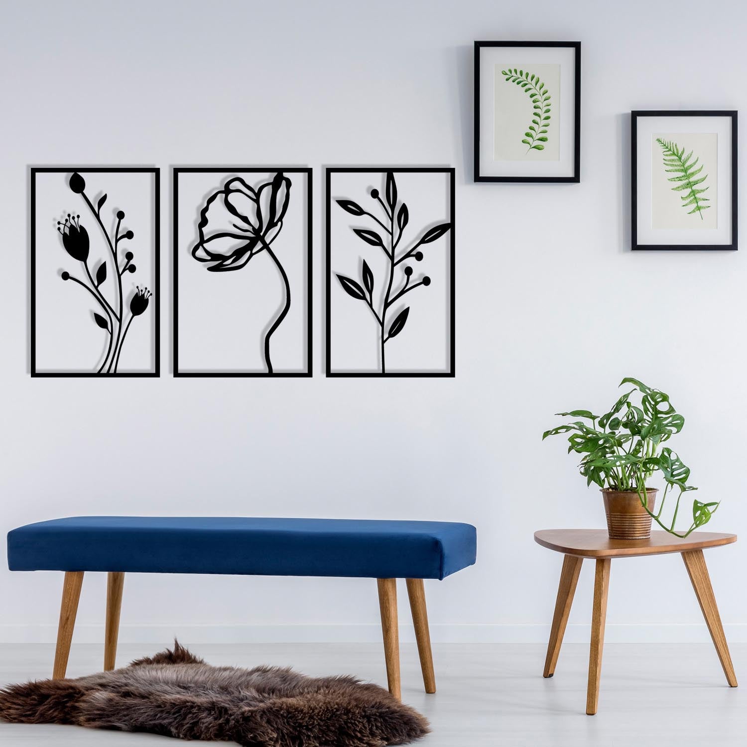 Verleihen Sie Ihrem Zuhause mit der Flowers Wanddeko von Wallity einen Hauch von Eleganz. Dieses schwarze Metall-Accessoire ist perfekt für jeden Raum.