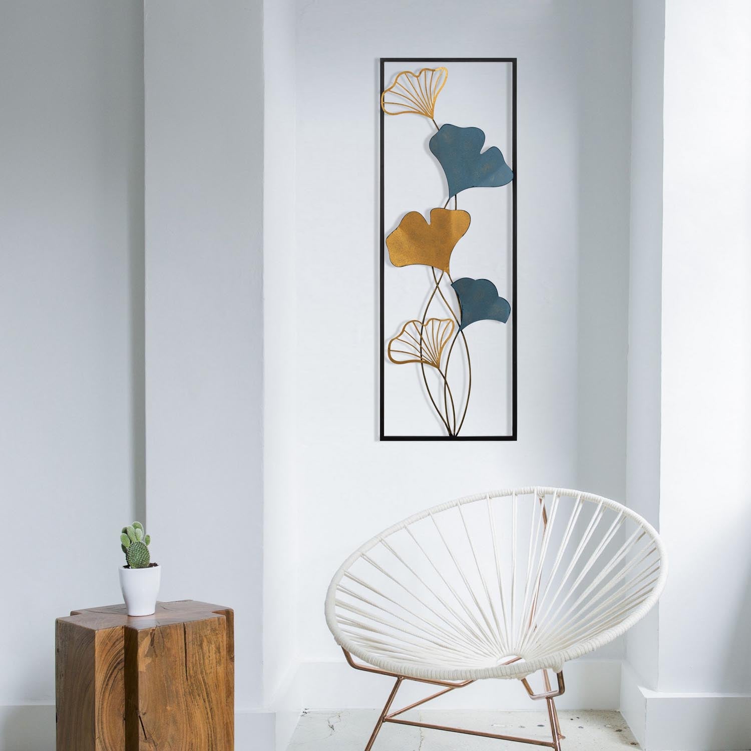 Verleihen Sie Ihrem Raum mit der mehrfarbigen Nadide Wanddeko von Wallity einen Hauch von Eleganz und Stil. Ein zeitloses Metall-Accessoire!