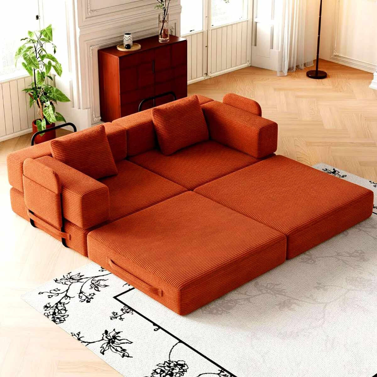 Ziegelrotes 3-Sitzer Schlafsofa aus Polyester-Leinen-Stoff mit Eisengestell, zwei Kissen und sichtbarer Sitz- sowie Liegefläche.