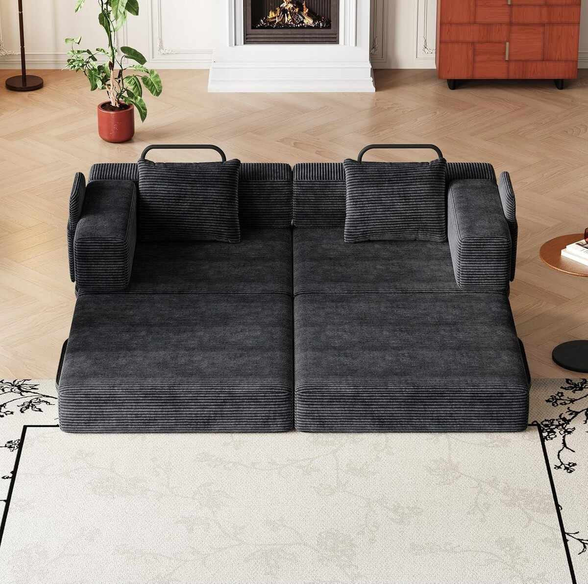 Schwarzes 3-Sitzer Schlafsofa aus Polyester-Leinen-Stoff mit zwei Kissen, schlichtes Design, ausgeklappt als Liegefläche sichtbar.