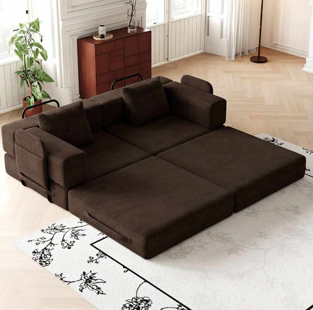 Braunes 3-Sitzer Schlafsofa aus Polyester und Leinen mit vier Eisen-Stützstreben, minimalistisches Design, zwei Kissen auf der Sitzfläche.