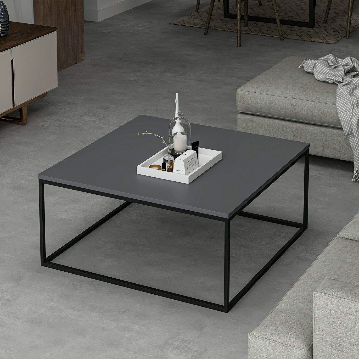 Entdecken Sie den Loni Sofatisch in Anthrazit von Hanah Home – ein elegantes Möbelstück, das Stil und Funktionalität perfekt vereint.