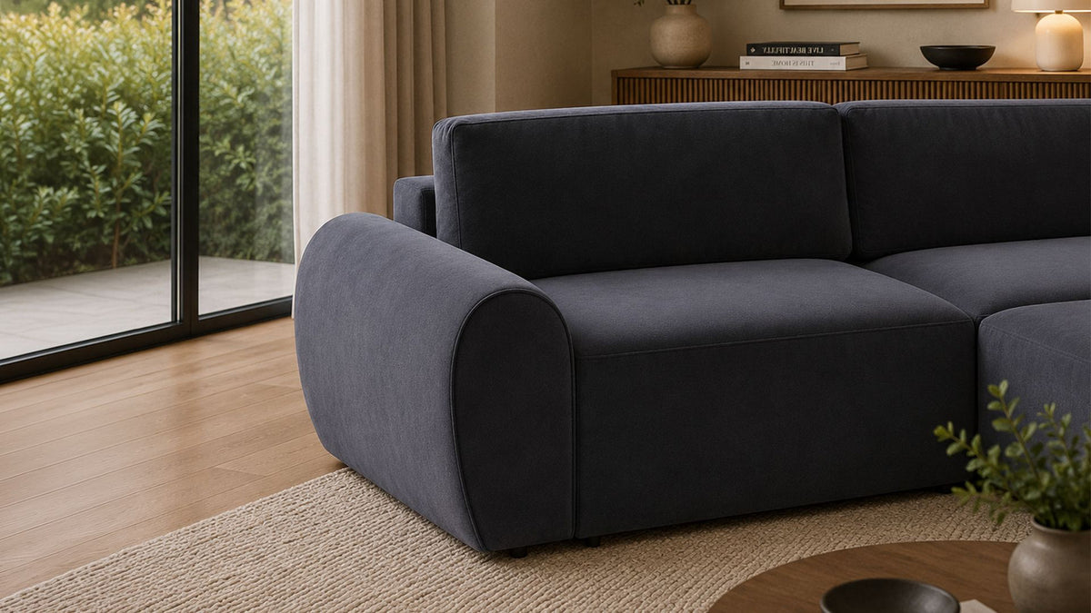 Petrolblaues Ecksofa mit Buchenholzgestell, Kunststoffbeinen und gepolsterten Sitzkissen, links ausgerichtet, Frontalansicht.