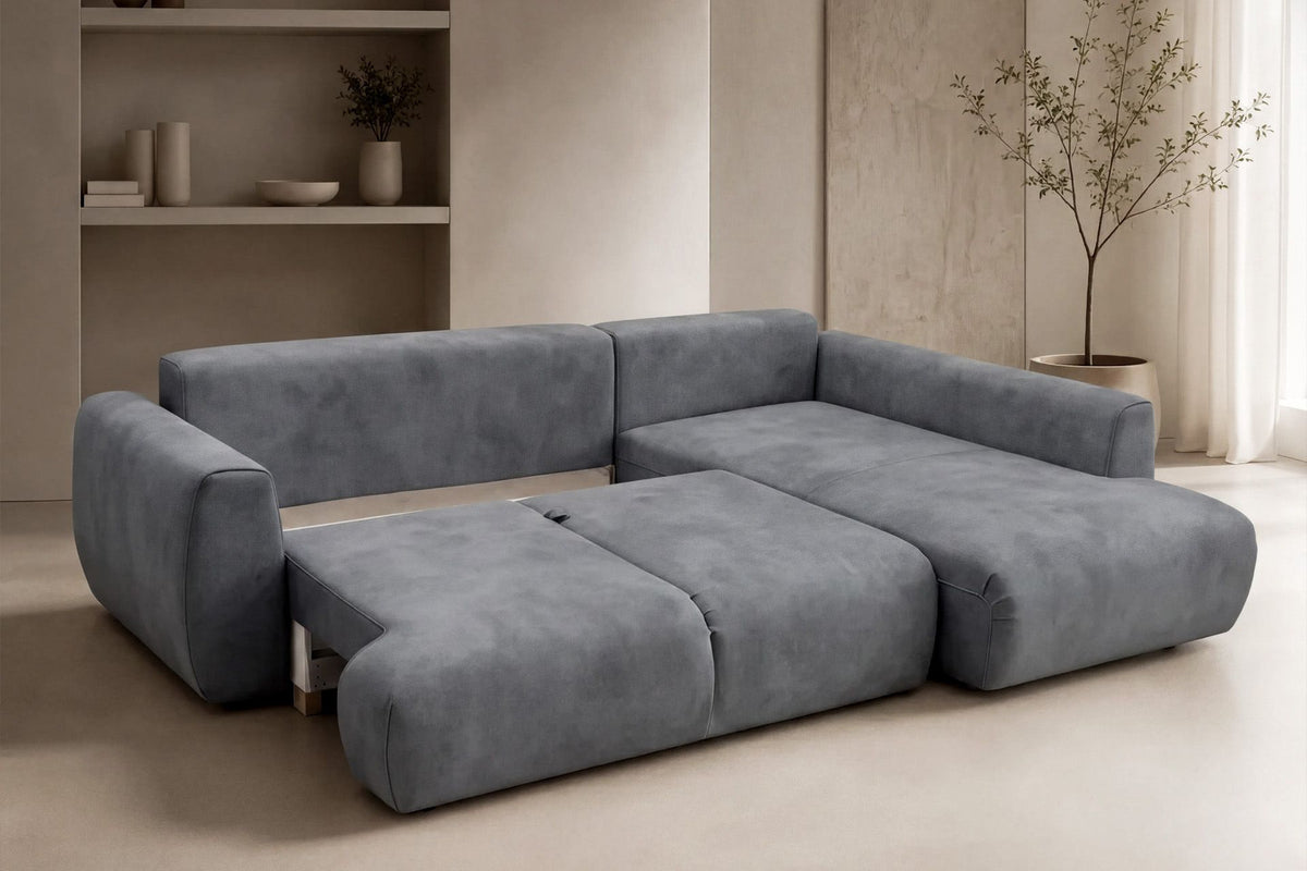 Graues Ecksofa rechts mit Schlaffunktion von Hanah Home, Bezug aus Polyester, Gestell aus Buchenholz und Spanplatte, mit zwei Kissen und Kunststoffbeinen.