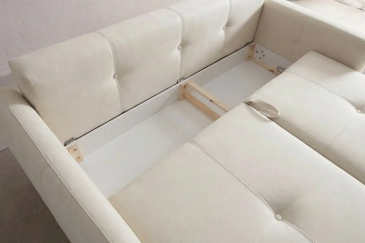 Ecrufarbenes 3-Sitzer Schlafsofa Magic von Hanah Home mit Polyesterbezug, Buchenholzgestell und Kunststoffbeinen im Wohnraum.