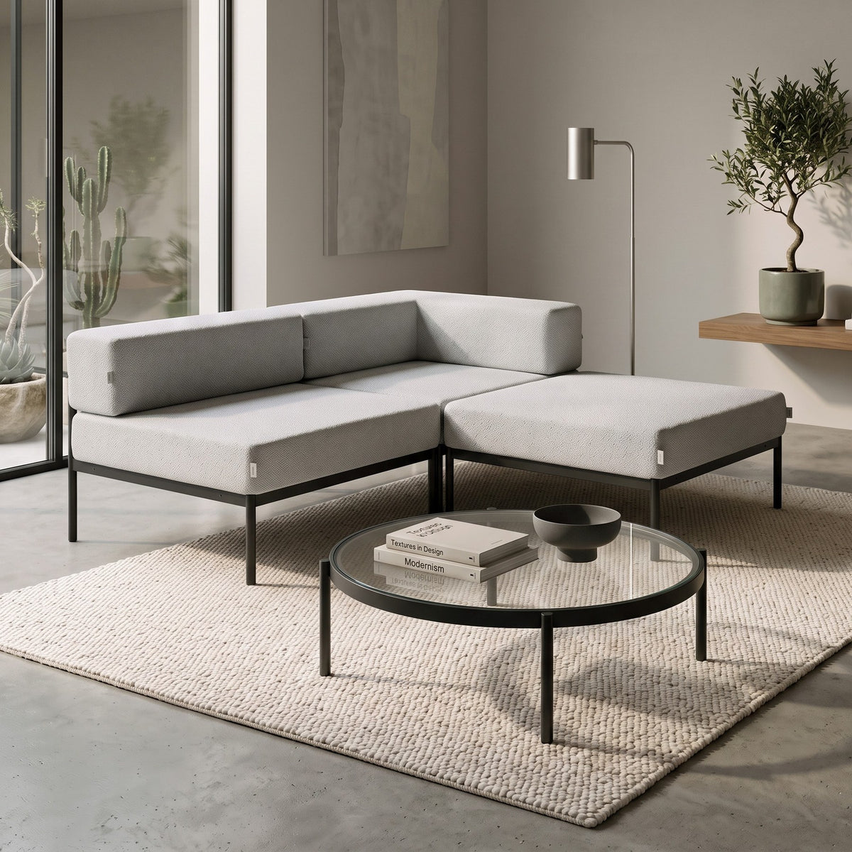 Ecksofa Corner Set 180 in Schwarz und Grau mit Bouclé-Stoffbezug, Metallgestell und schlanken Metallbeinen, grosszügige Sitzfläche.