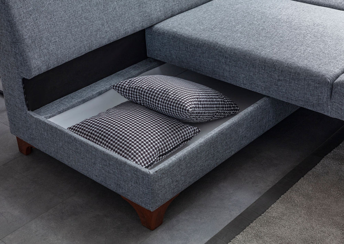 Graues Eckschlafsofa T-Loft mit Polyesterbezug in Leinenstruktur, Holzgestell, abnehmbarem Rückenkissen und mehreren Kissen.