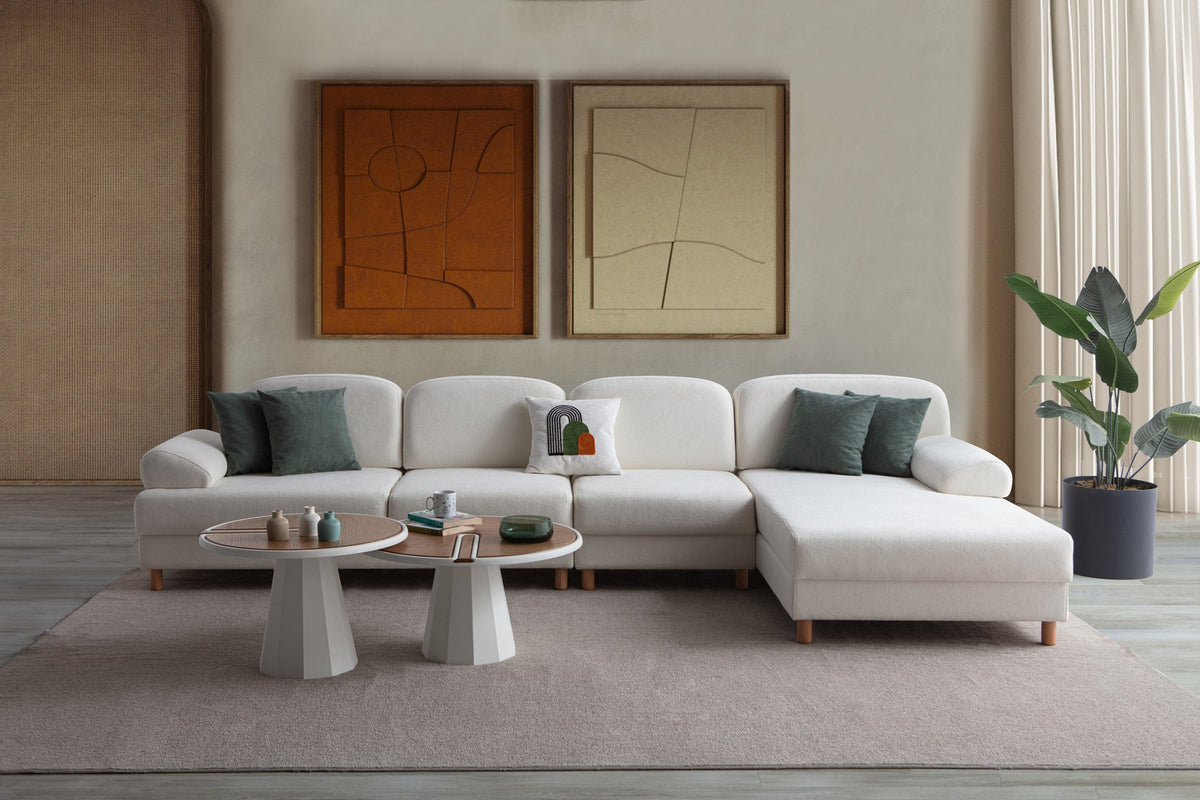 Weisses Eck-Schlafsofa Aries Relax Joker mit Coco-Boucle-Stoff, Holzbeinen und integrierter Aufbewahrungstruhe, rechte Ausführung, Ansicht von vorne.
