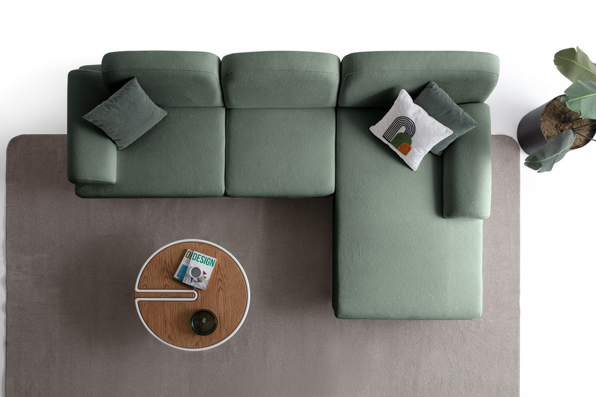 Grünes Eck-Schlafsofa Aries von Hanah Home mit Coco-Boucle-Stoff, Holzbeinen und Aufbewahrungstruhe, rechts ausgerichtet.