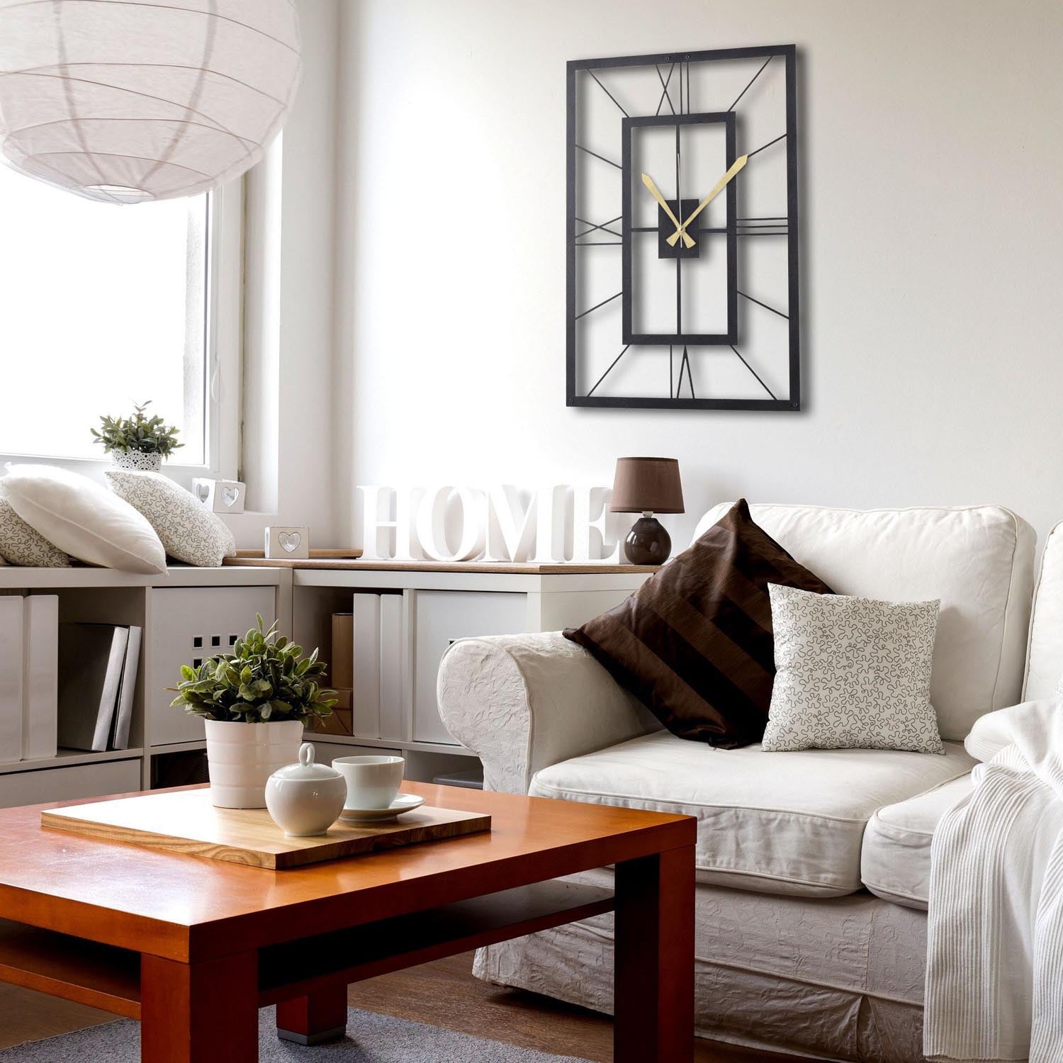 Gestalten Sie Ihr Zuhause mit der stilvollen Wanduhr "November" von Wallity. Diese elegante schwarze Metall-Uhr (49x34,5 cm) vereint Langlebigkeit und modernes Design.