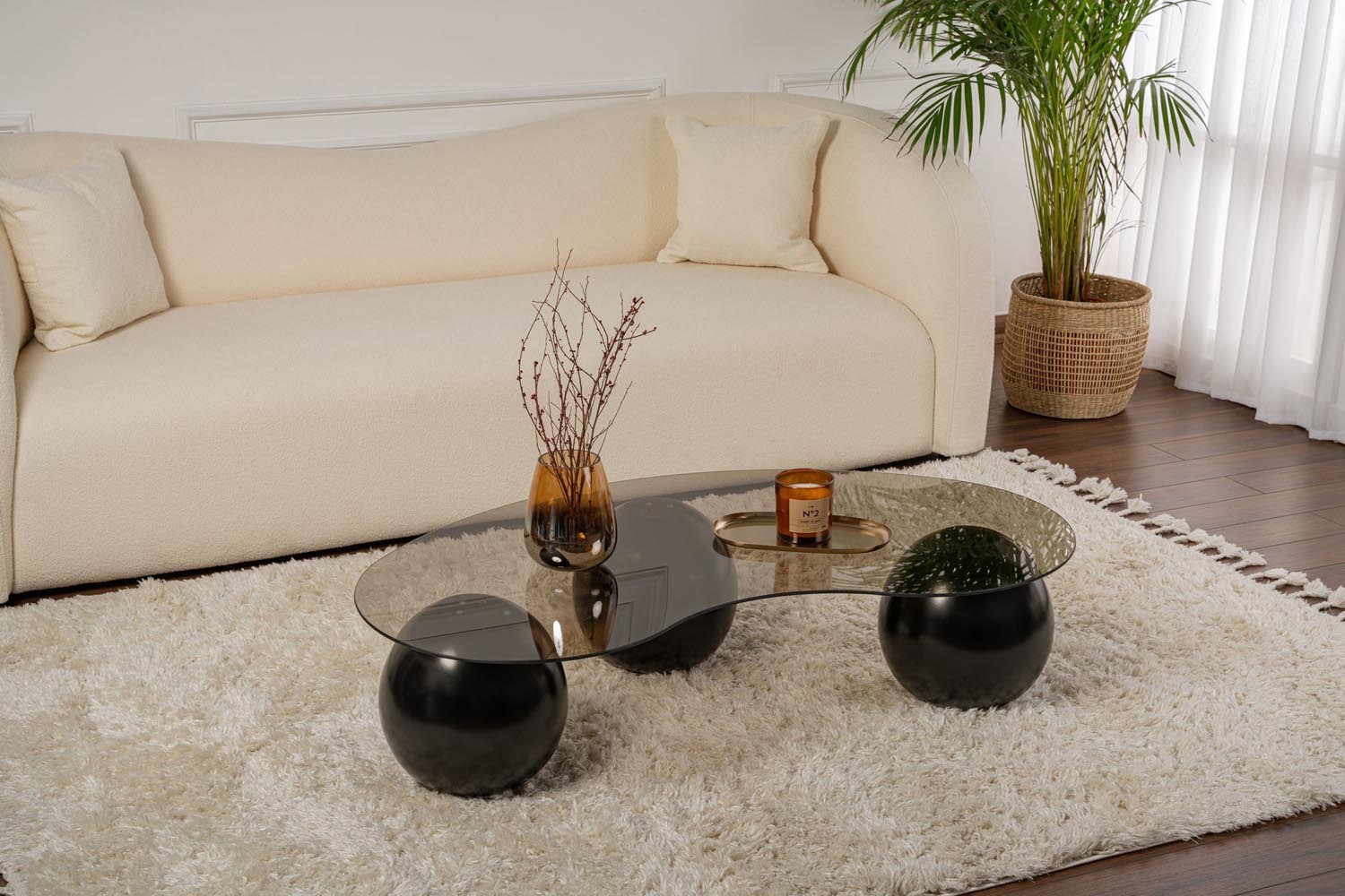 Entdecken Sie den eleganten Sphere Sofatisch in Schwarz und Bronze von Nordure. Ideal für stilvolle Akzente in Ihrem Wohnraum.