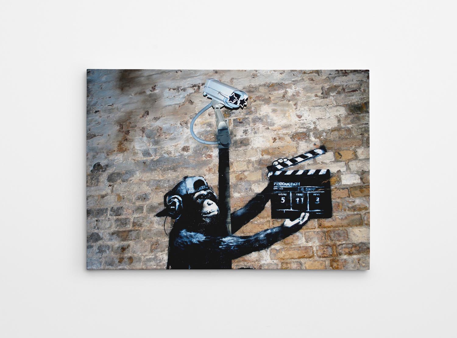 Bringen Sie mit dem gerahmten Bild WY43 (70 x 100) von Wallity Farbe und Stil in Ihr Zuhause. Ein emotionales Kunstwerk von Banksy!