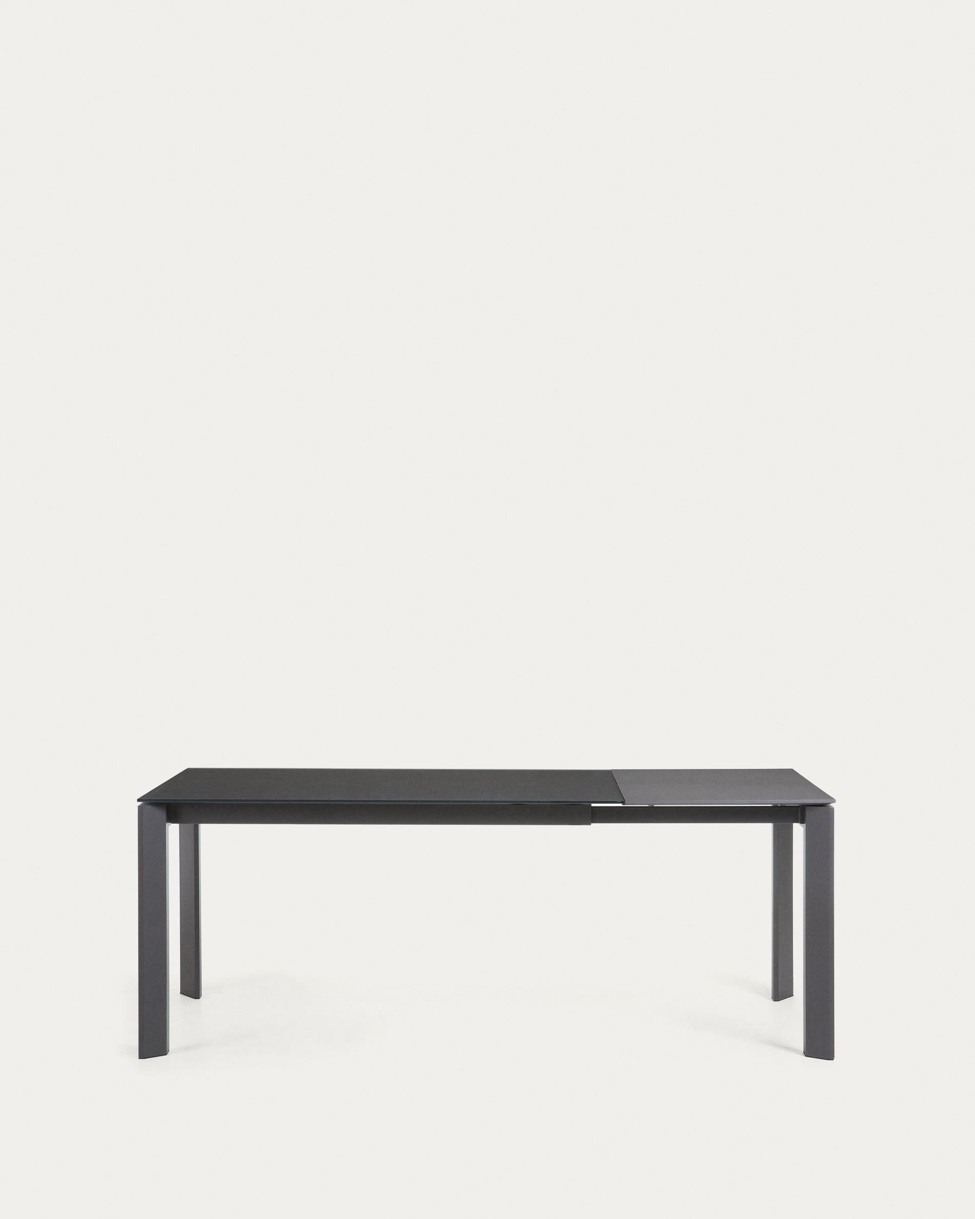 Eleganter Axis Tisch mit grauer Glasplatte und dunkelgrauen Stahlbeinen, ausziehbar von 140 auf 200 cm, ideal für modernes Wohnen.