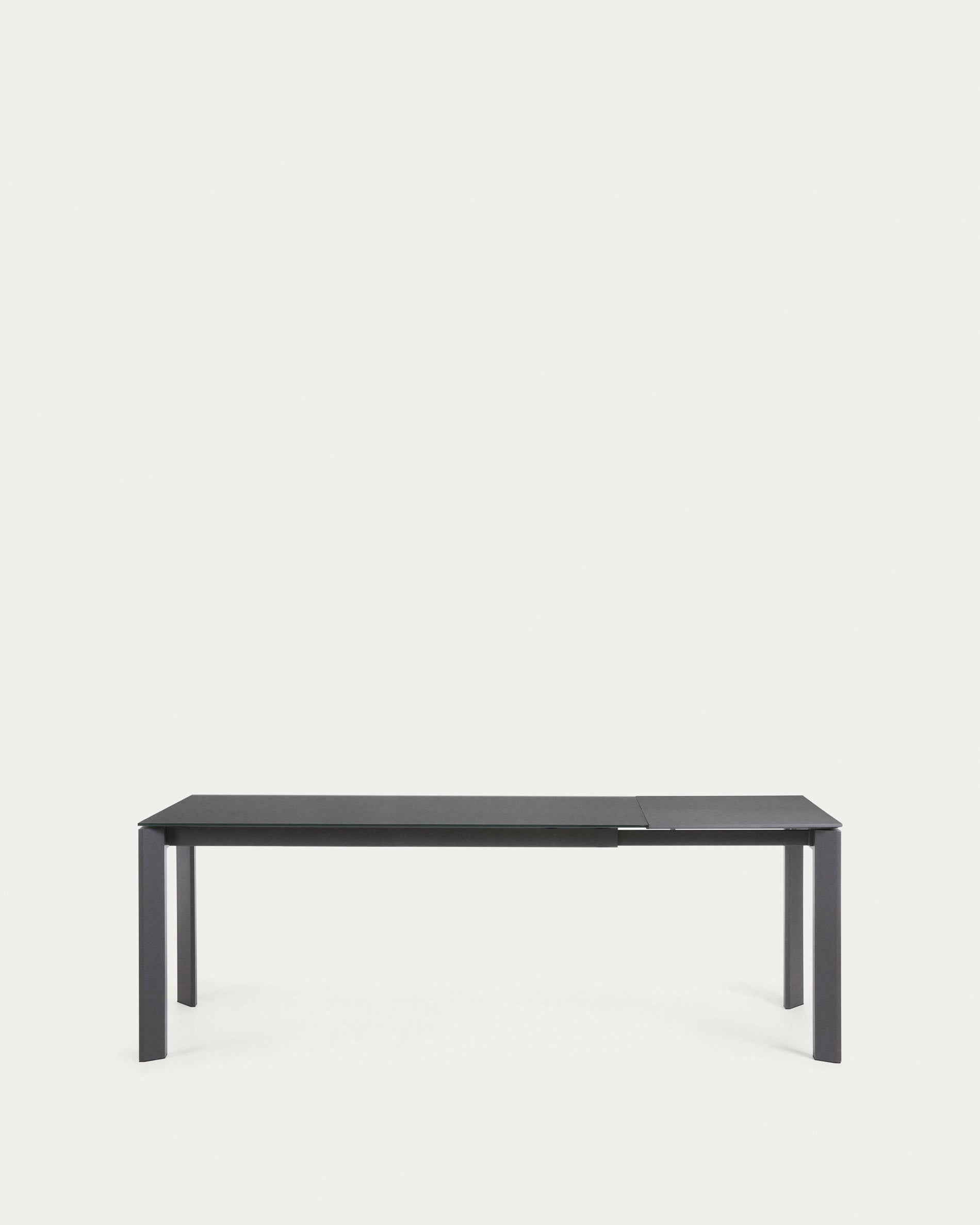 Eleganter Axis Tisch mit grauer Glasplatte und dunkelgrauen Stahlbeinen, ausziehbar von 160 auf 220 cm, modern und stilvoll.