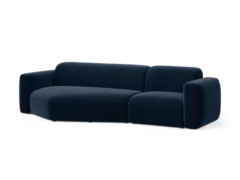 Elegantes Strino Velour Ecksofa links in Royal Blue, ideal für stilvolle Wohnräume. Modular und komfortabel, perfekt für entspannte Abende.