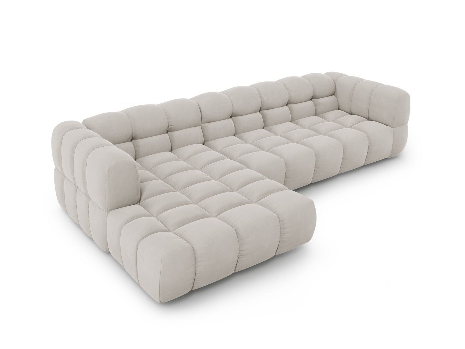Modulares Ecksofa links im luxuriösen Sky Velour, 4-Sitzer in sanftem Beige, perfekt für moderne und elegante Wohnambiente.