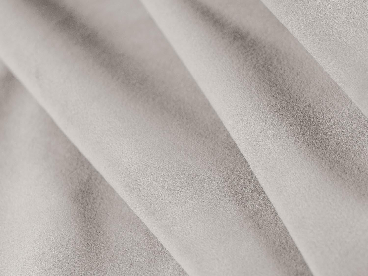 Modulares 4-Sitzer Ecksofa links aus weichem Sky Velour in sanftem Beige, perfekt für moderne und elegante Wohnkonzepte.