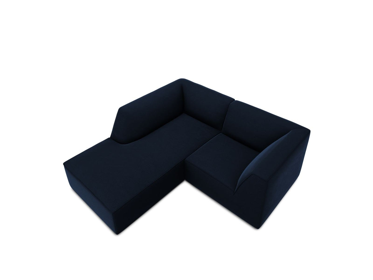 Modulares Ecksofa in Beige-Samt mit Récamiere links, Massivholzrahmen, schwarzen Kunststoffbeinen und weicher Samtpolsterung.