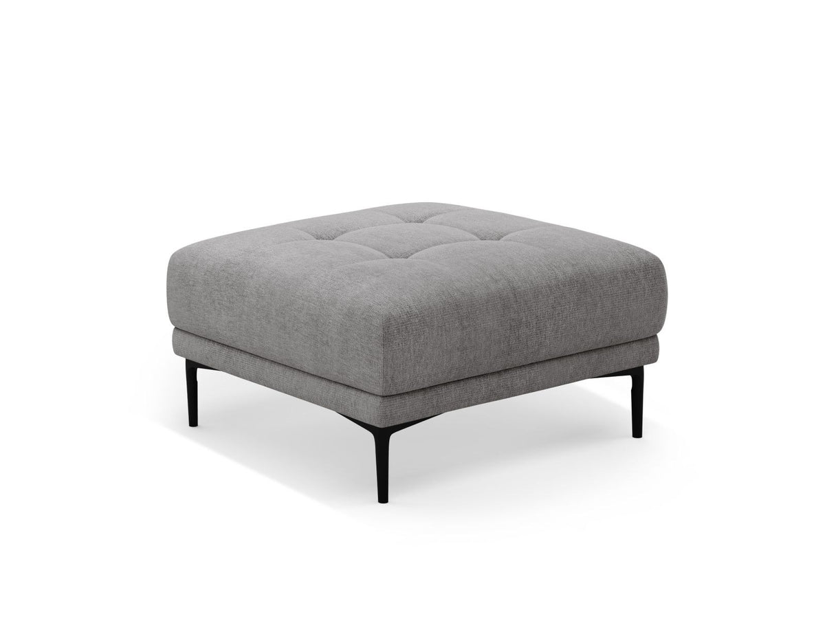 Runder Pouf mit beigem Sorella-Strukturstoff, gepolstertem Sitz und schwarzen Metallbeinen, freistehend fotografiert vor neutralem Hintergrund.