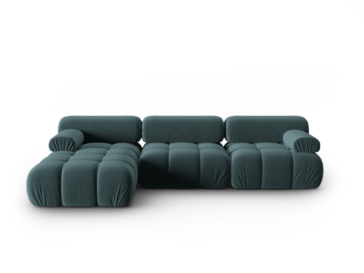 Modulares Ecksofa mit rosa Samtstoff, schwarzen Kunststoffbeinen und gepolsterter Récamiere, Ansicht von vorne links.
